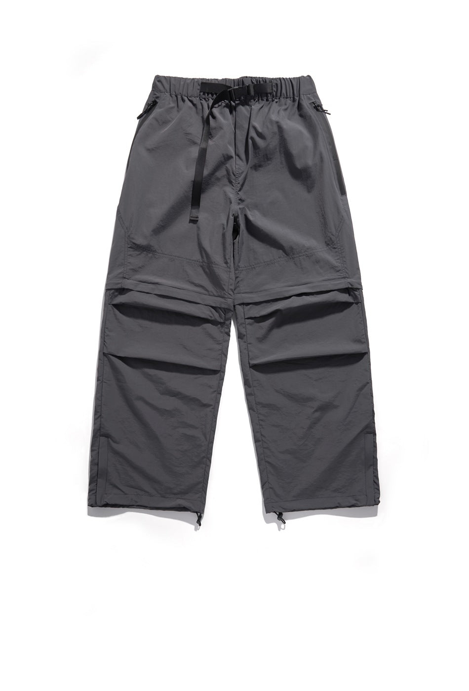 Front view of charcoal gray wide-leg pants with an elastic waist, belt, zip pockets, panel seams and adjustable hems.