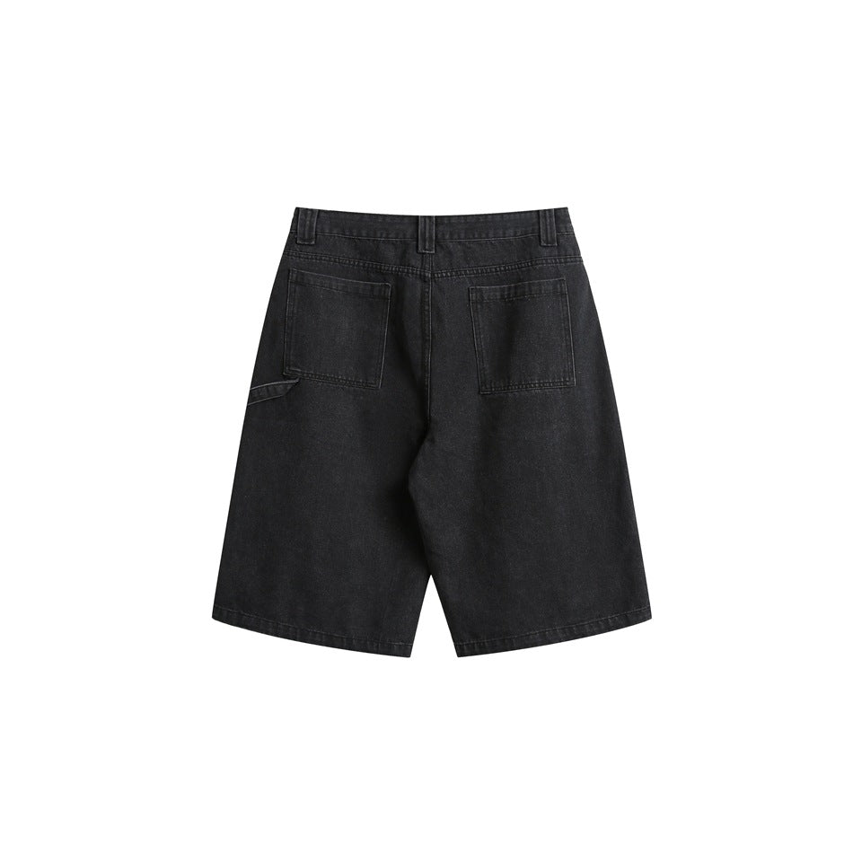 Rear view of black denim knee-length shorts with two back pockets and a small side loop.