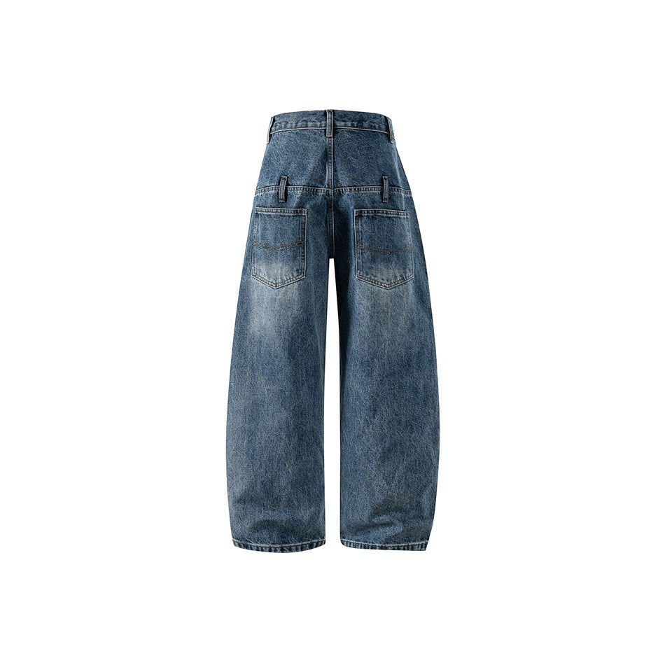 Back view of washed blue wide-leg barrel jeans with two patch pockets and faded denim finish