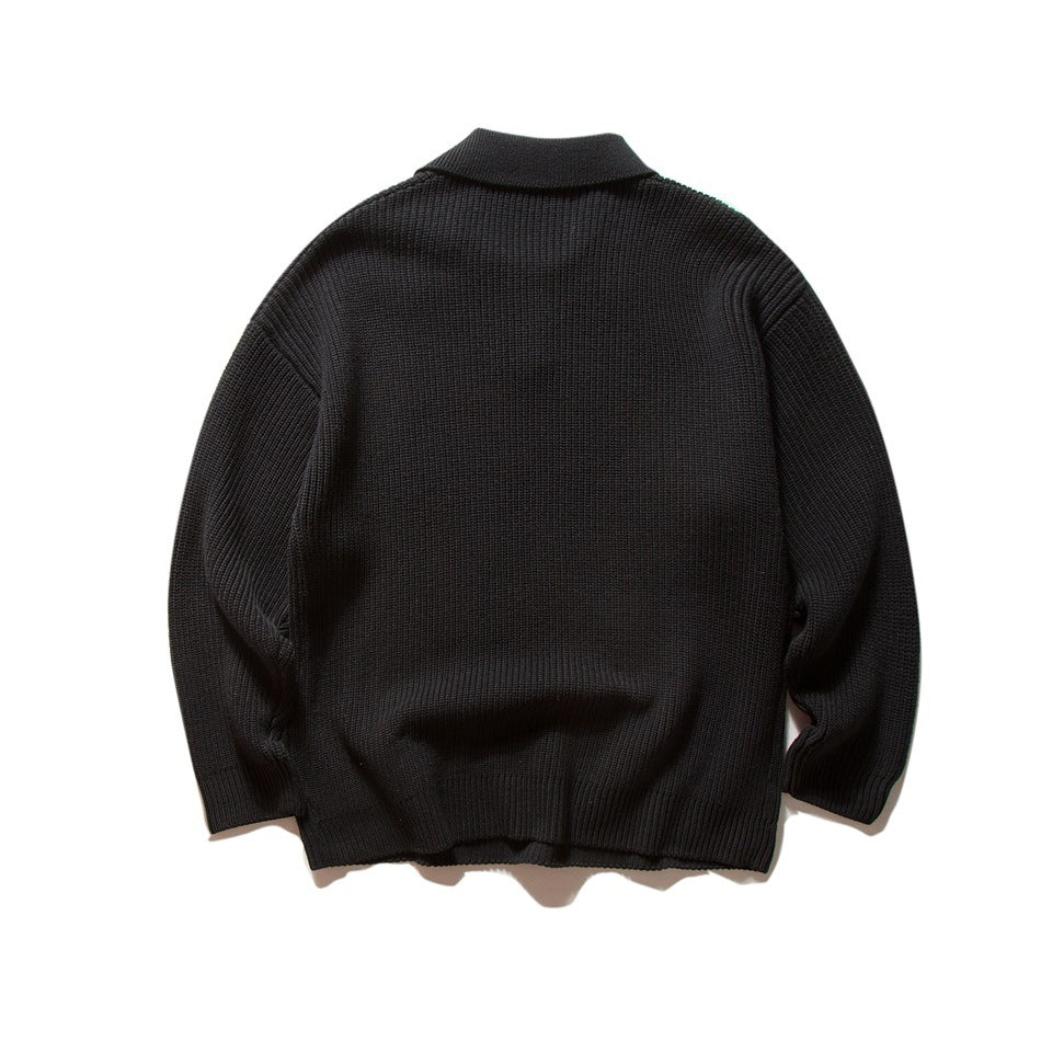 Back view of a black long-sleeve knitted polo sweater with a folded collar.