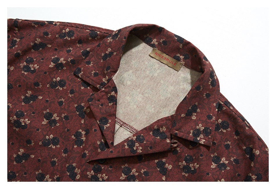 Burgundy floral shirt collar and inner neck label shown in a close-up.