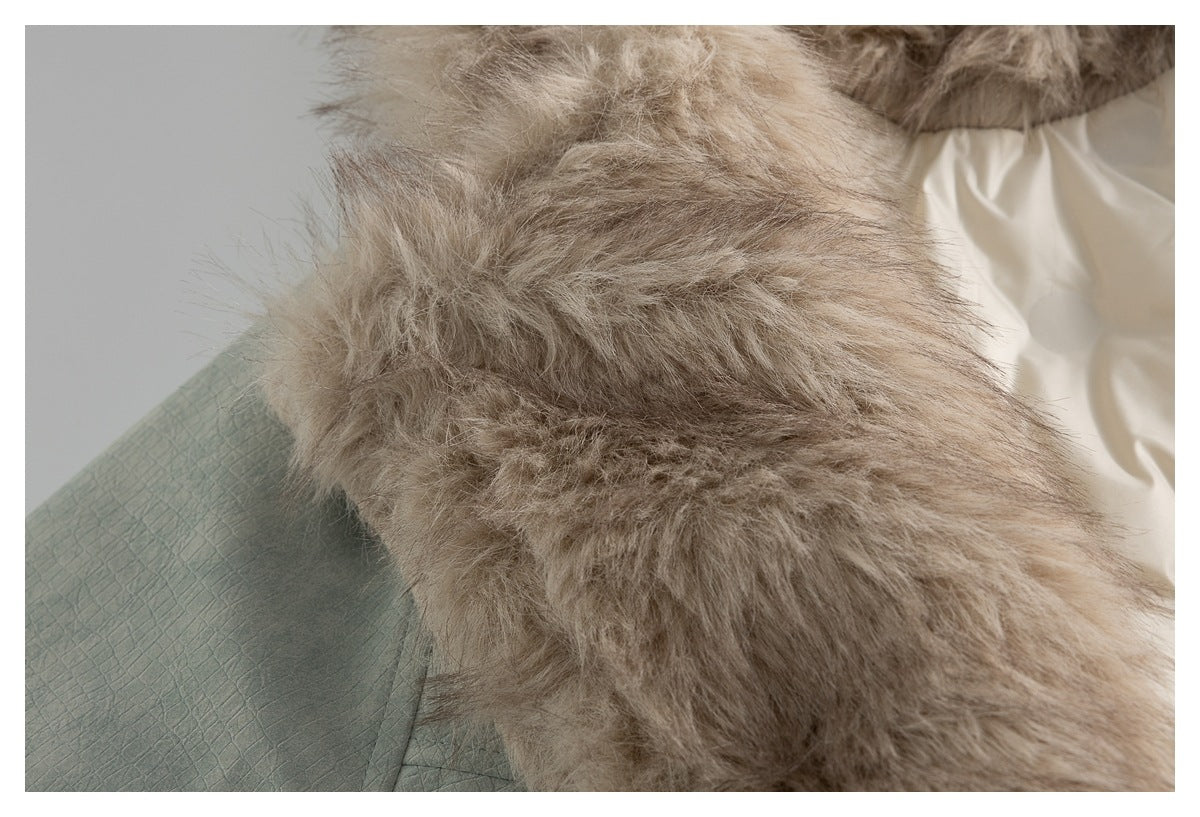 Close-up of a beige faux-fur trim beside sage-green fabric with a raised square texture.