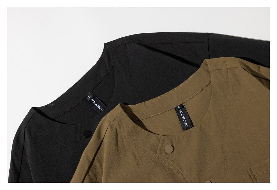Close-up of overlapping black and brown garment necklines with buttons and sewn-in labels.