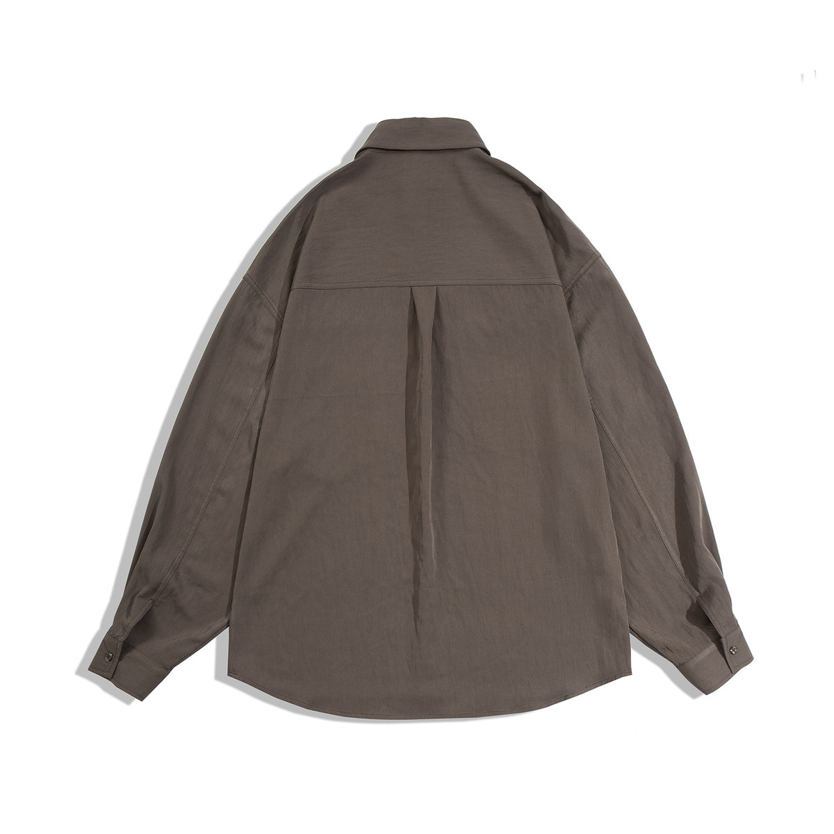 Back view of a dark brown oversized long-sleeve button-up shirt with a yoke and center pleat.