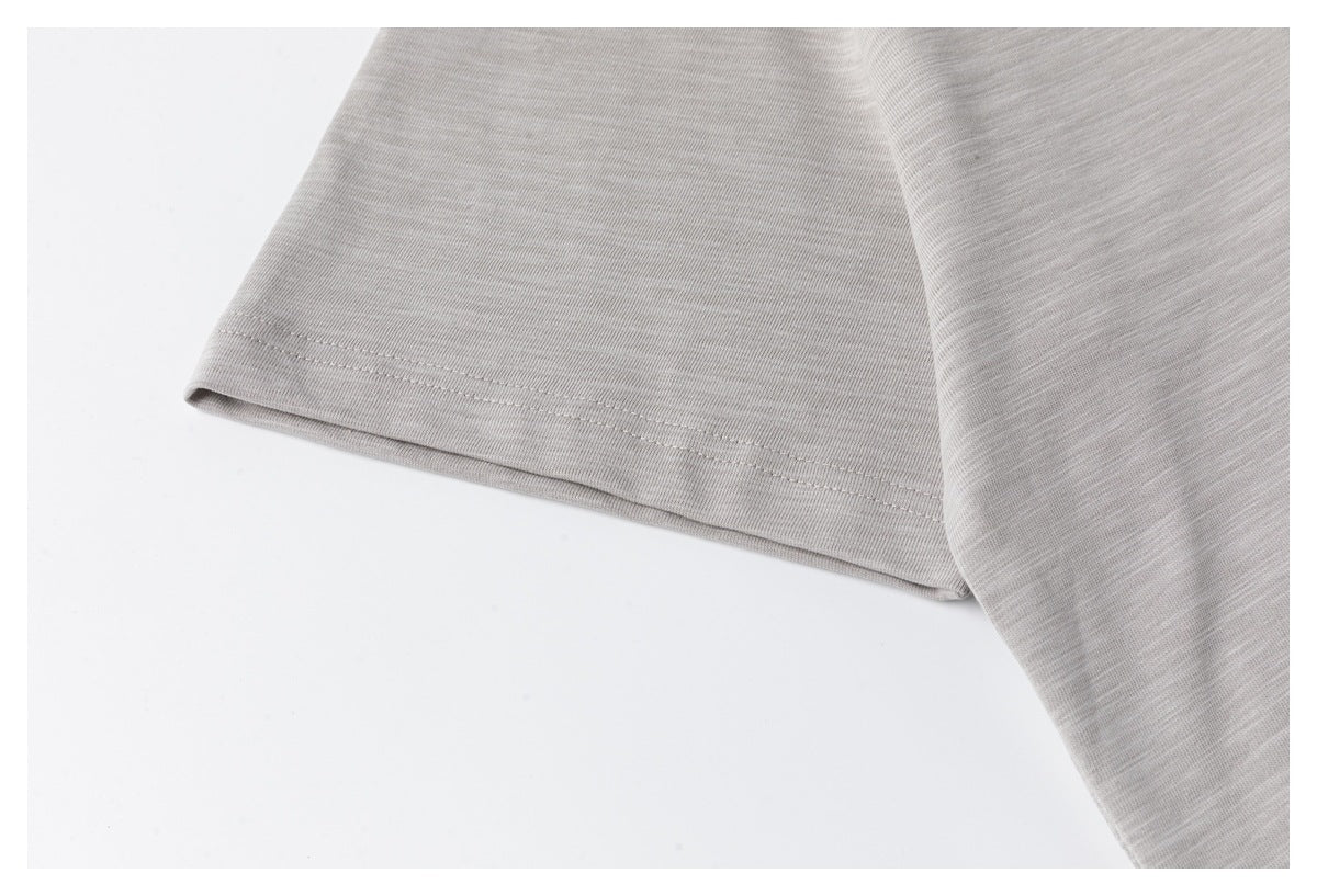 Close-up of the light gray short sleeve and its stitched hem.