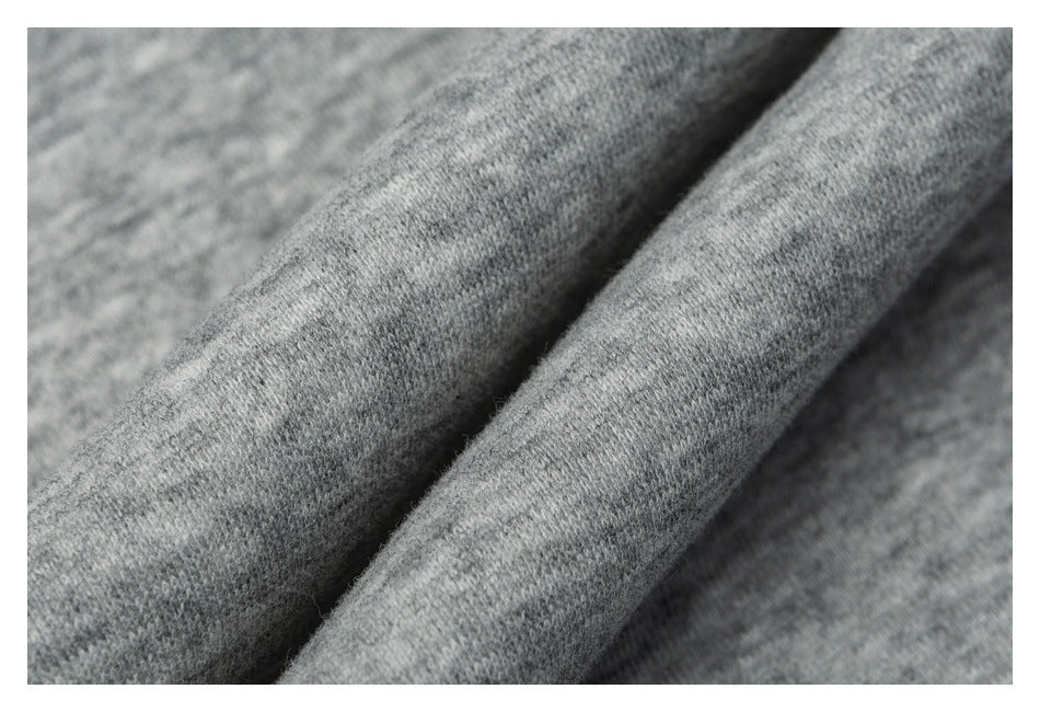 Macro view of the heather gray garment fabric and its knit texture.
