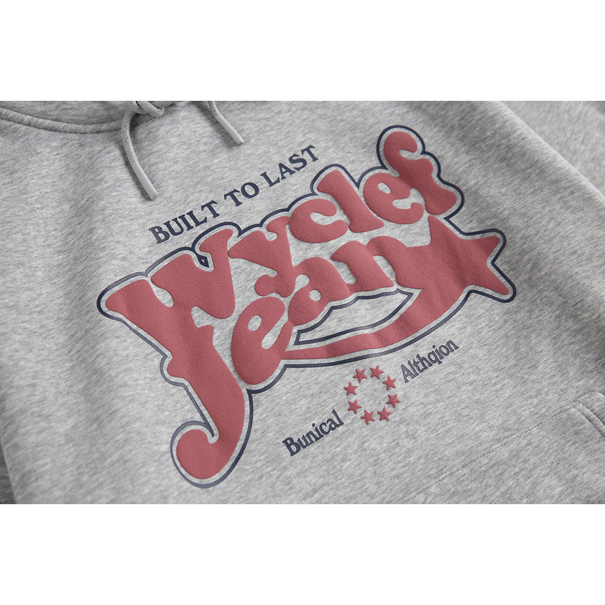 Close-up of a heather-gray hoodie with a large red and navy English-lettered chest graphic.