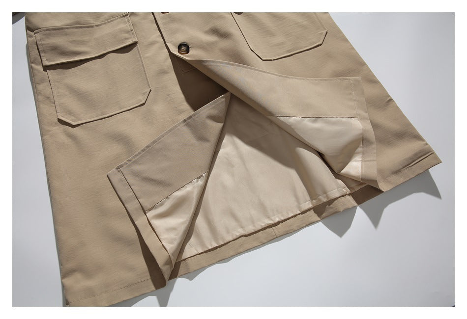 Beige coat opened at the lower front to show its pale lining and patch pockets.