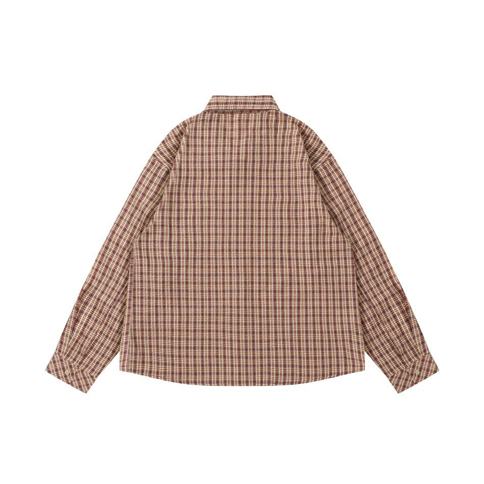 Back view of red and tan plaid long-sleeve shirt with buttoned cuffs, flat lay