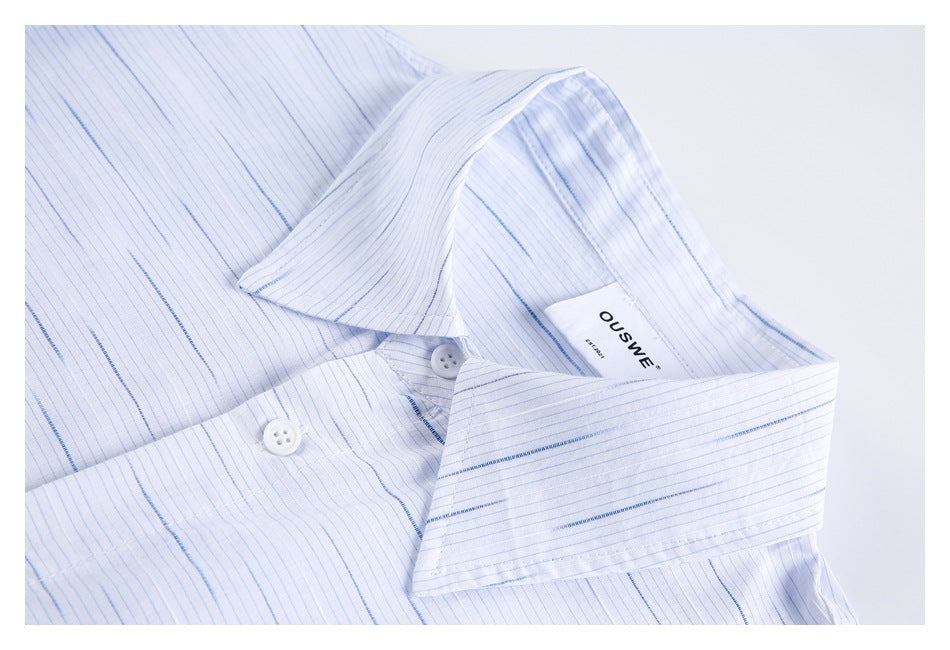 Close-up of the striped shirt collar, buttons, and sewn-in OUSWE label.