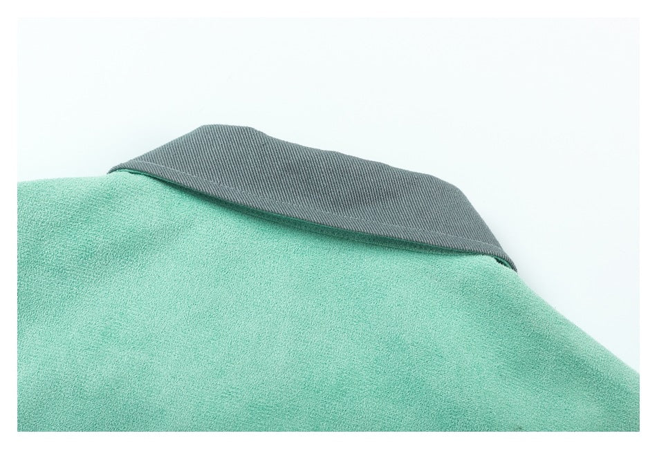 Close-up of the mint-green garment's upper edge with a contrasting gray collar.