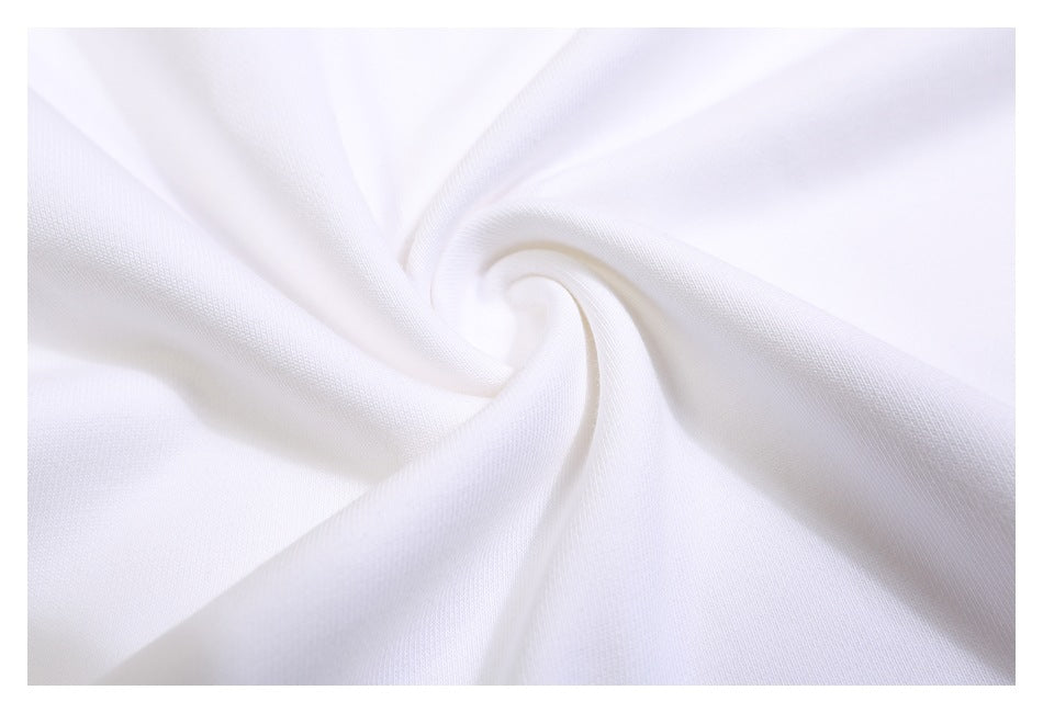 Close-up of white sweatshirt fabric gathered into a soft spiral fold.