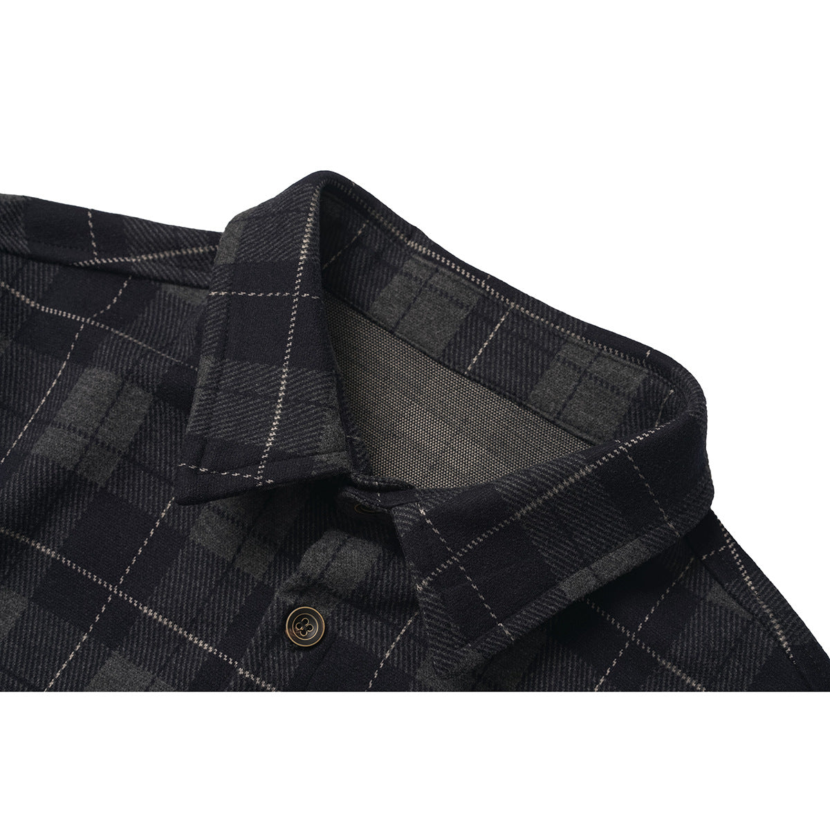 Close-up of a dark gray and black plaid shirt collar, neckline, and button.