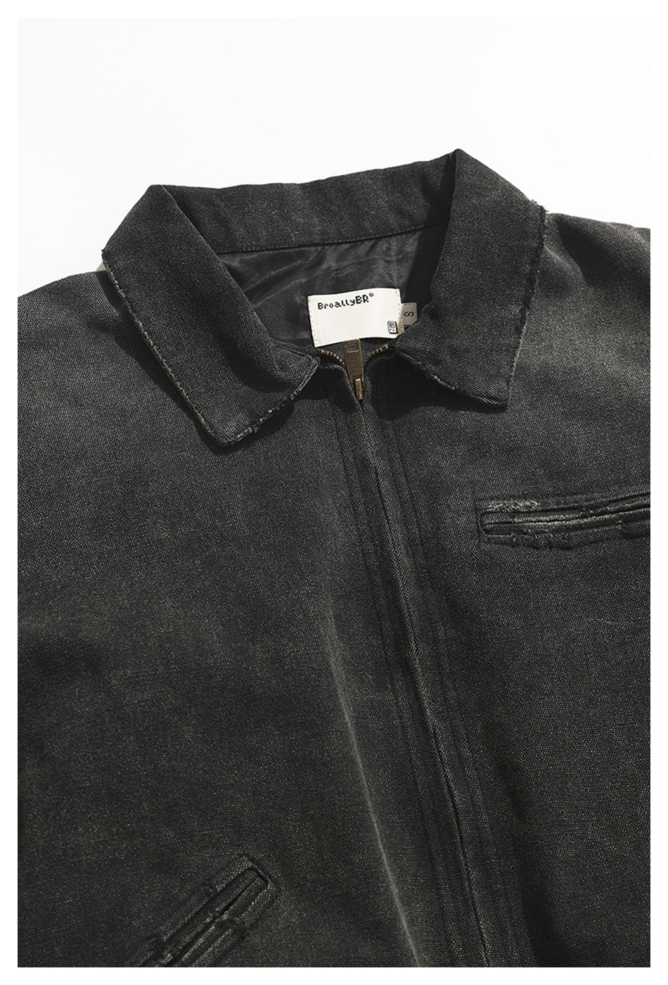 Upper front of a charcoal jacket showing its collar, zipper, and welt pockets.