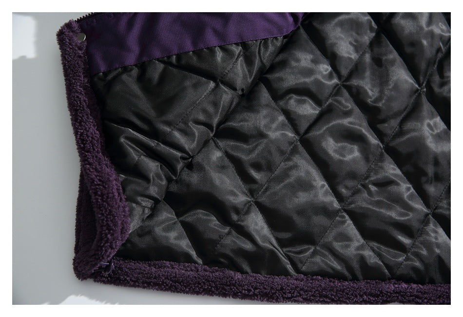 Close-up of black diamond-quilted lining bordered by deep purple fleece trim.