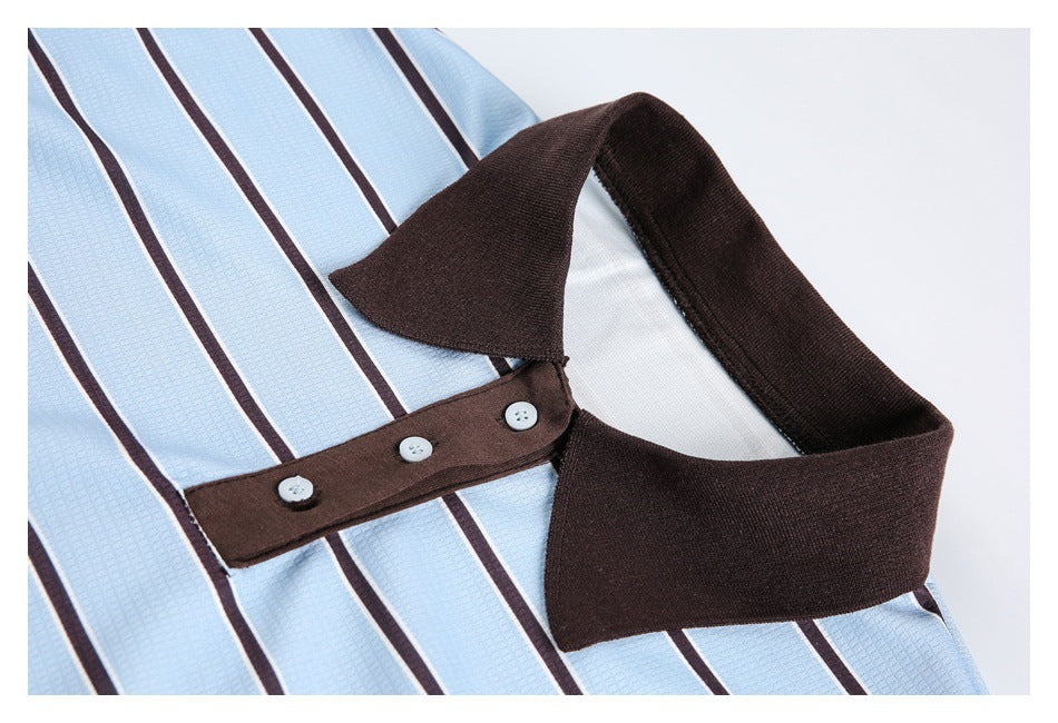 Close-up of the dark brown collar and buttoned sleeve tab on a light blue striped top.