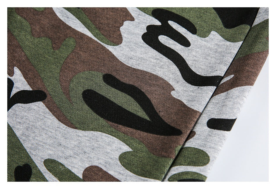 Close-up of the pants’ green, brown, black, and gray camouflage print and fabric surface.