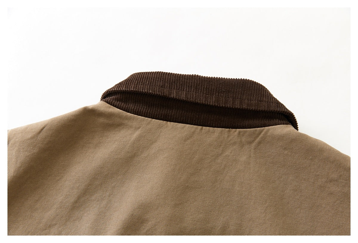 Close-up of the dark brown collar and upper back of a tan vest.