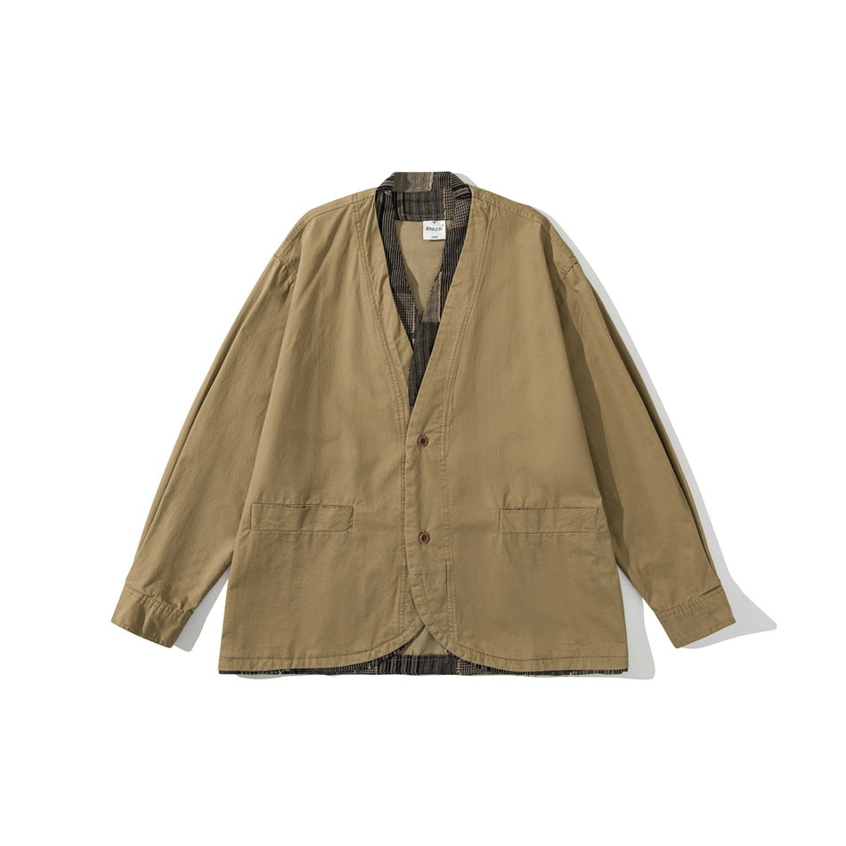 Khaki collarless V-neck jacket, flat lay front view, with two buttons, flap pockets and brown plaid trim