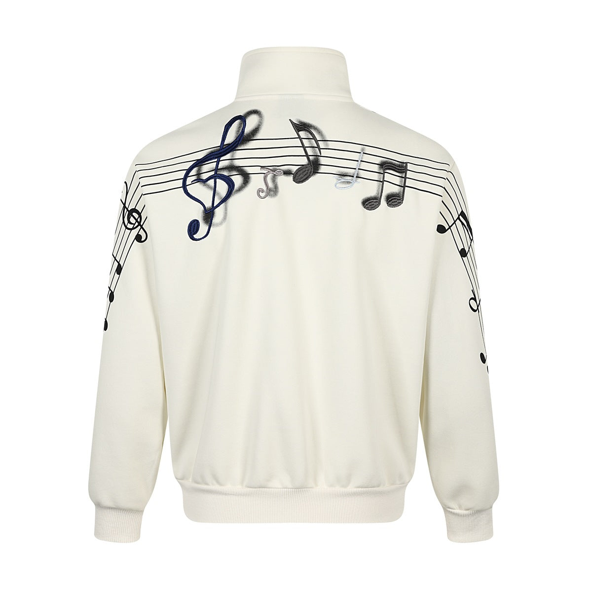 Back of cream-white jacket with embroidered treble clef and music notes across the shoulders and staff lines on sleeves
