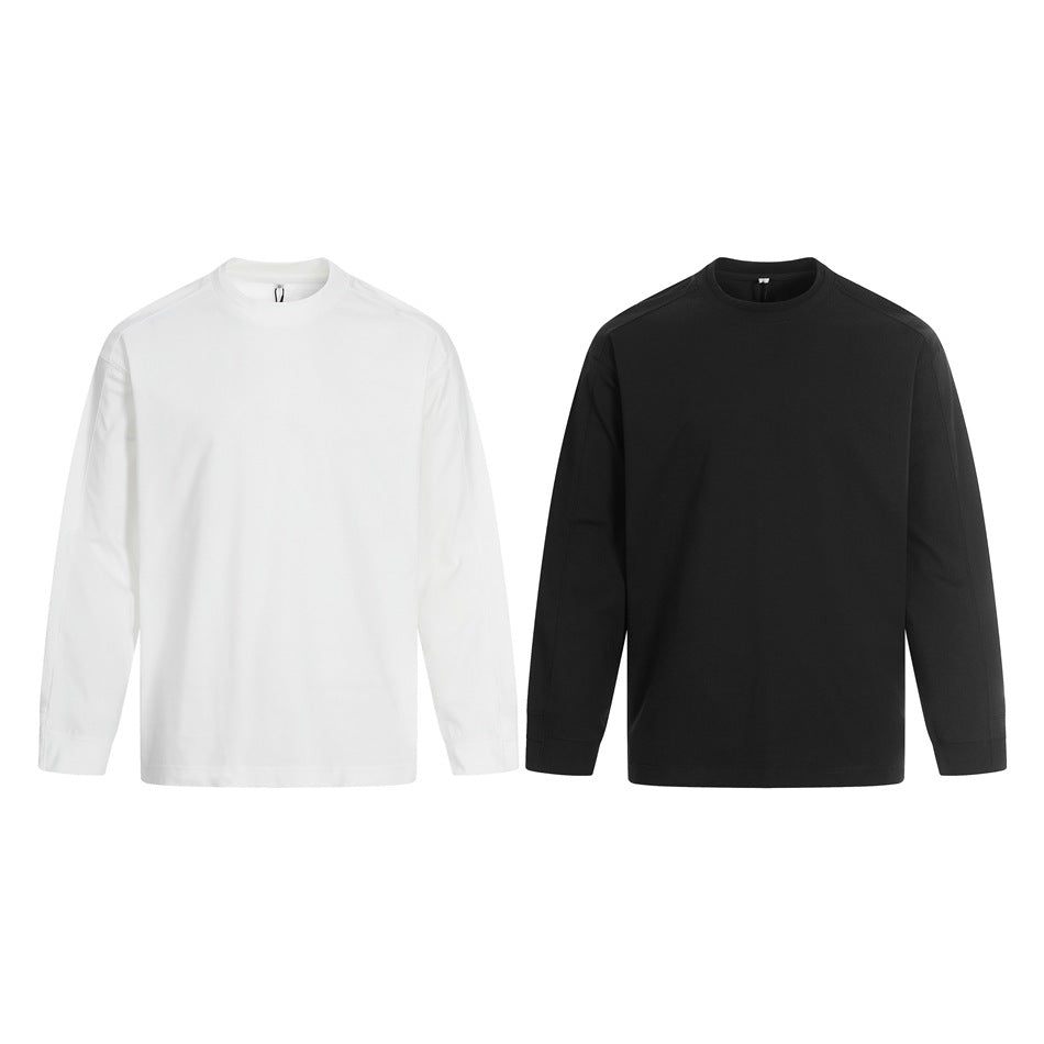 Two plain long-sleeve crewneck tops shown from the front, one white and one black.