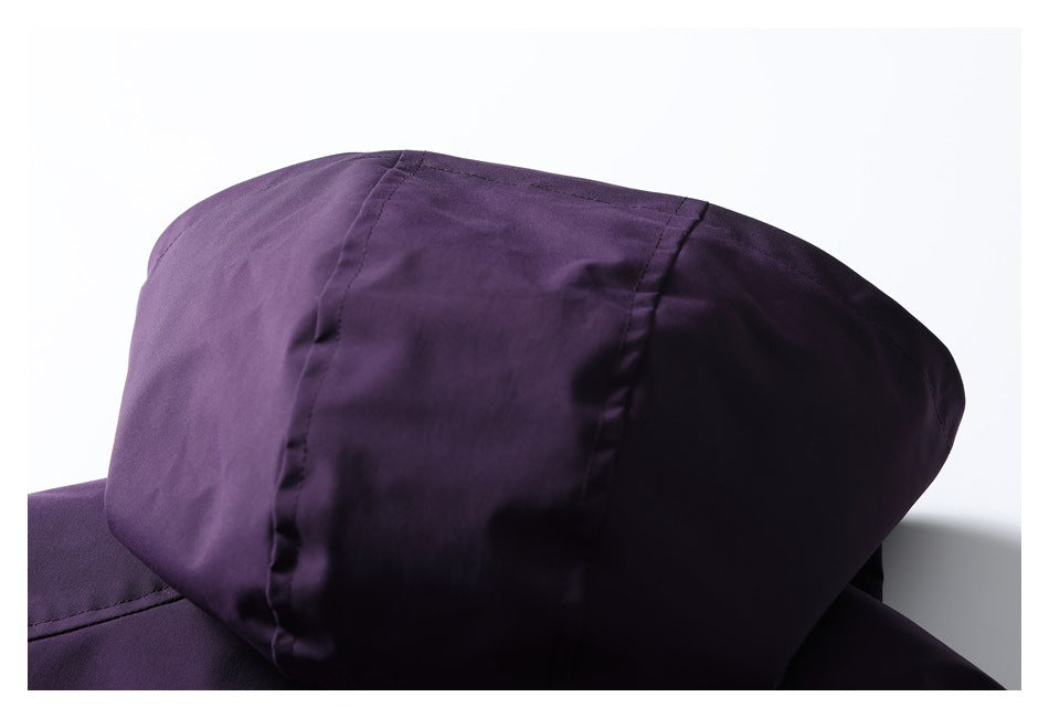 Close-up of the deep purple jacket's hood, showing its panel seams.