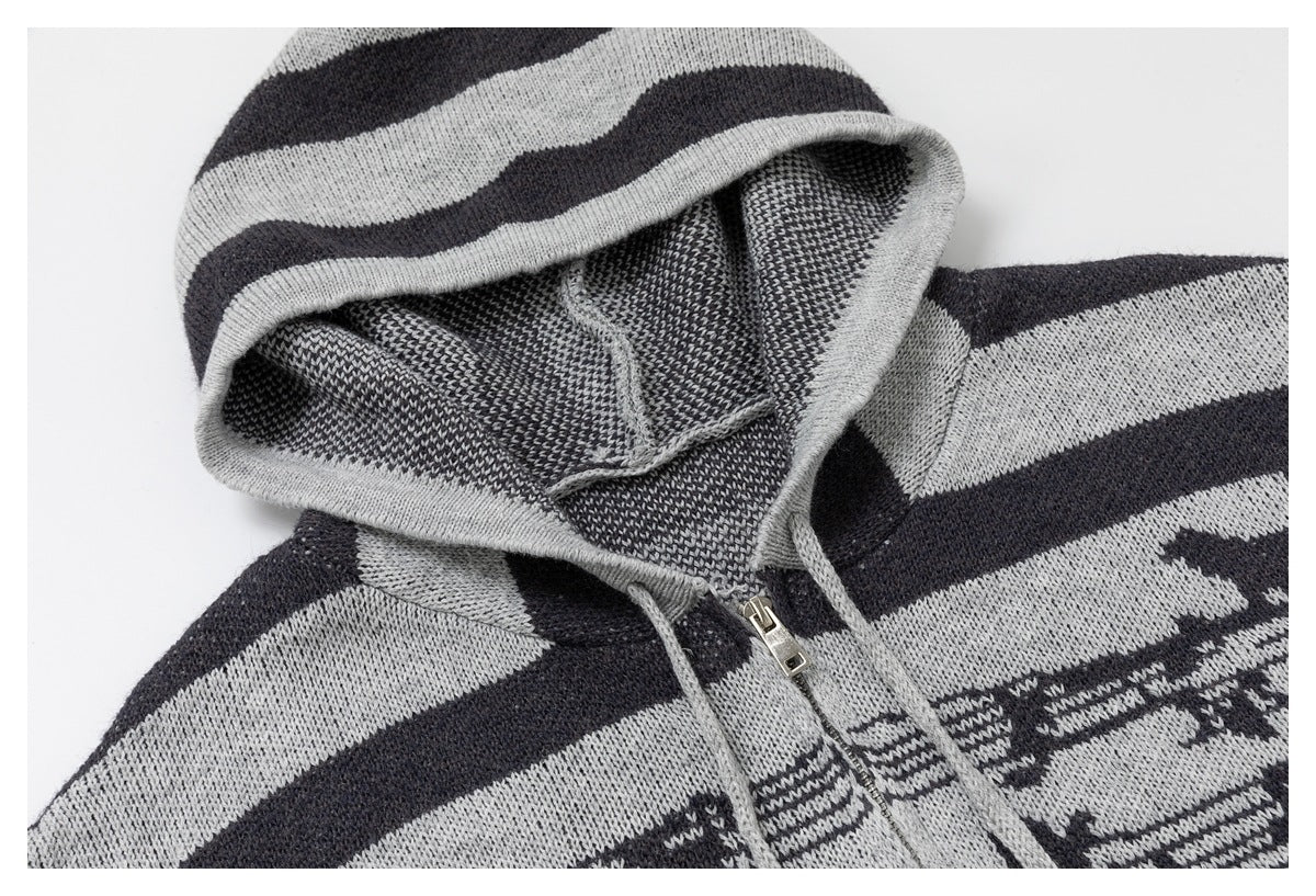 Close-up of a gray-and-charcoal striped knit hoodie with a hood and front zipper.