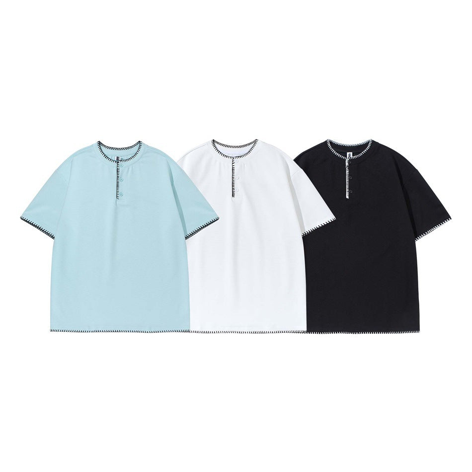 Three short-sleeve shirts shown from the front in pale blue, white, and black, each with contrast edge stitching.