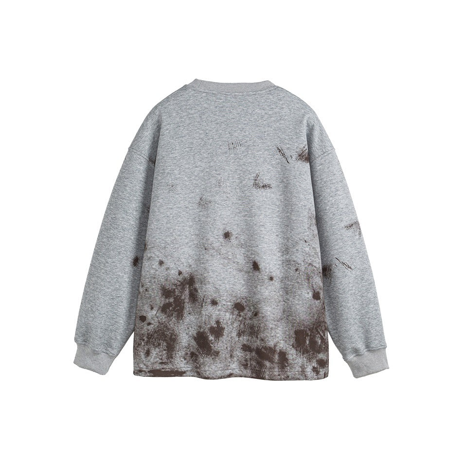 Back view of a heather gray crewneck sweatshirt with dark distressed marks across the lower half.