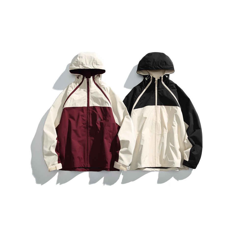 Two hooded jackets displayed side by side: cream and burgundy, and cream with black sleeves and hood.