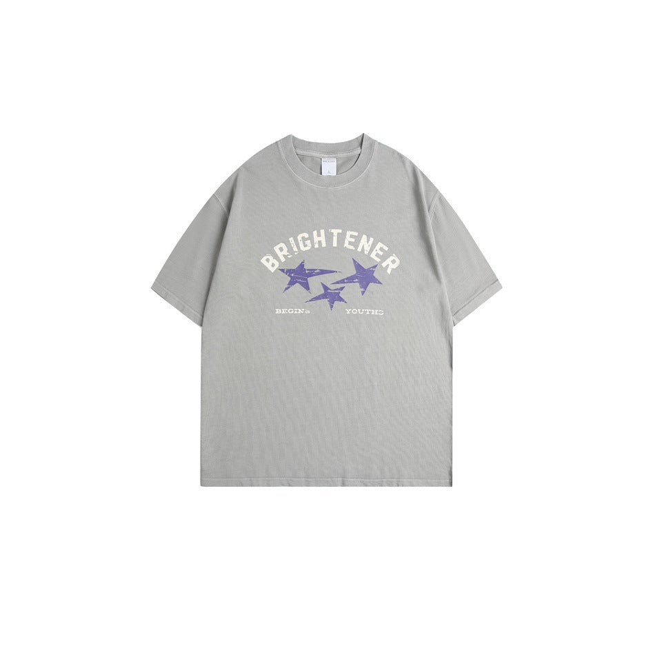 Cement gray short-sleeve T-shirt with cream BRIGHTENER lettering and three purple distressed stars