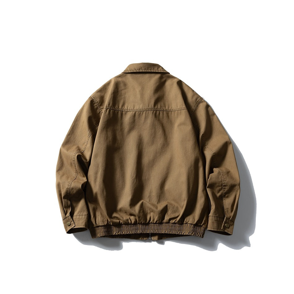 Back view of a brown jacket with a pointed collar, shoulder seam and gathered elastic hem.