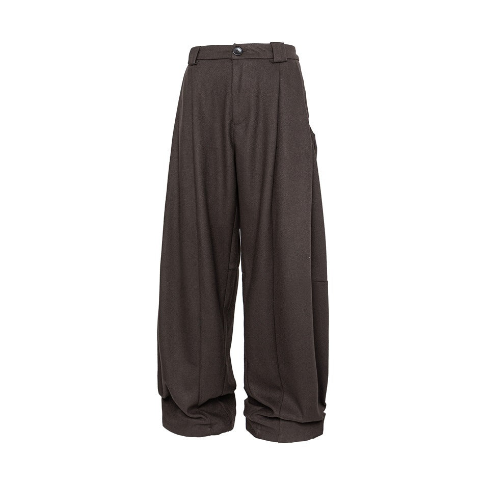Brown wide-leg pleated trousers with button waistband, front view on white background