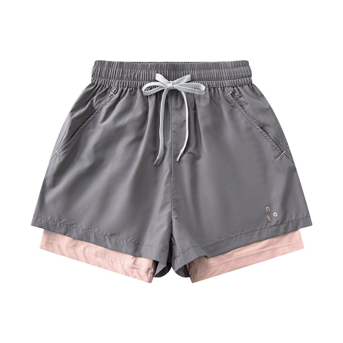 Dark gray women's two-layer shorts with drawstring waist, side pockets and pink inner layer, front flat lay