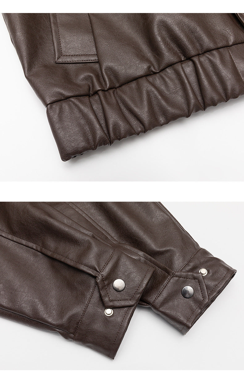 Close-ups of the brown jacket's gathered hem and snap-button sleeve cuff.