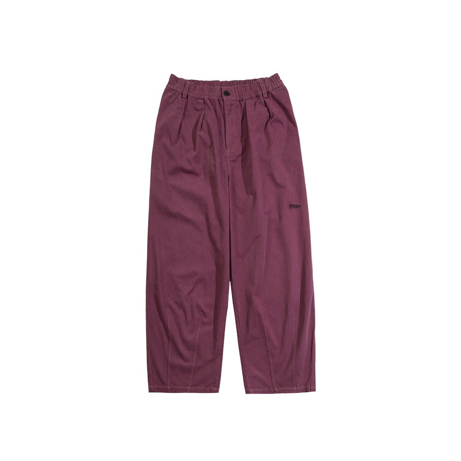 Burgundy wide-leg pants with elastic waistband, front button and small embroidered logo, flat lay on white