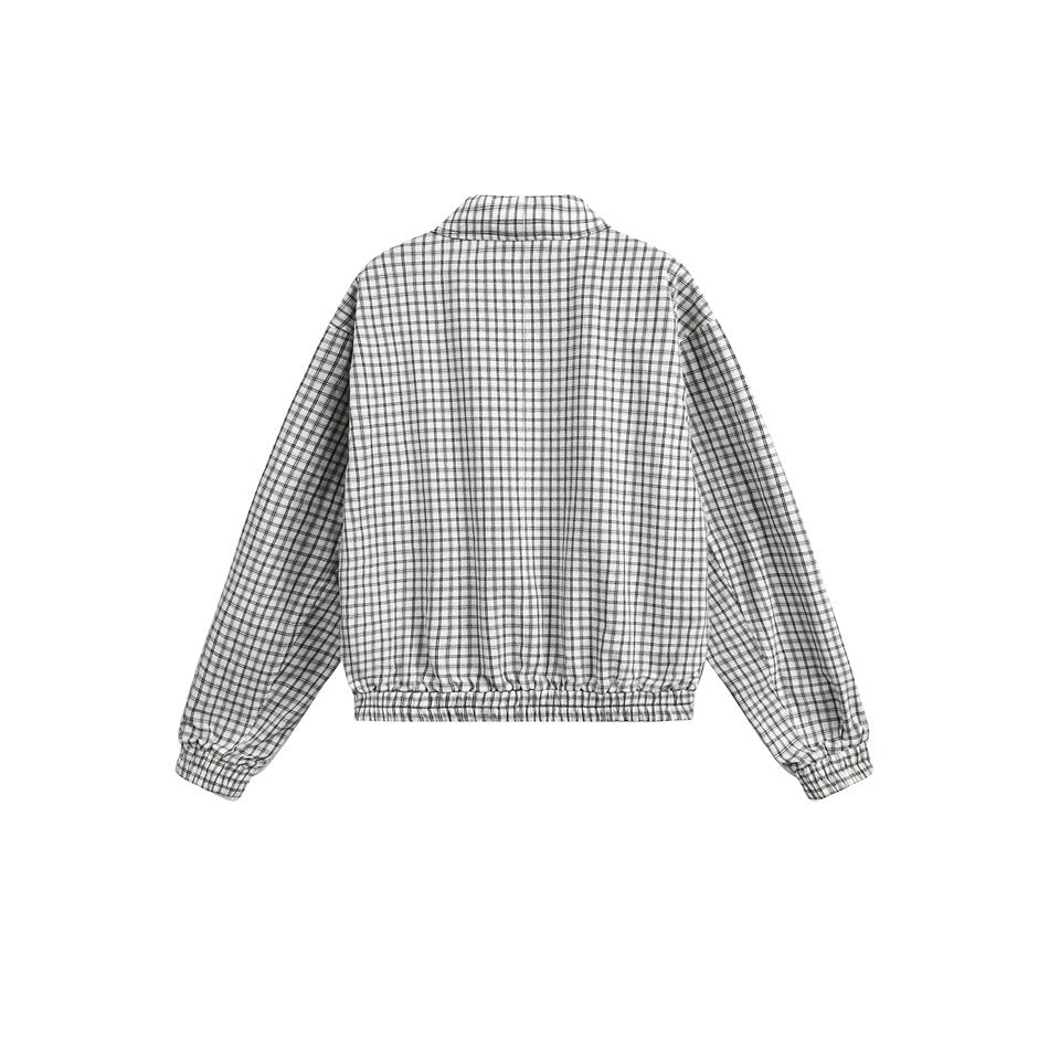Back view of a white jacket with a fine black check pattern, long sleeves and elastic cuffs and hem.