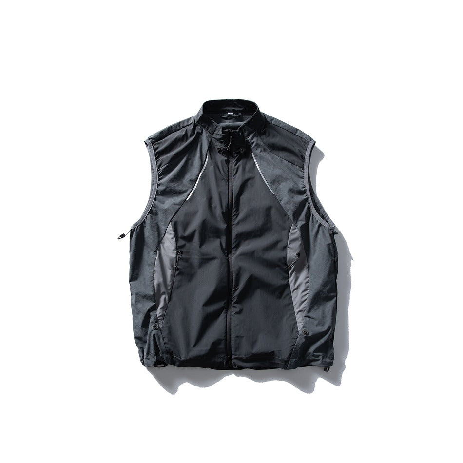 Black sleeveless vest with a stand collar, front zipper, contrast side panels, and zip pockets, shown against white.