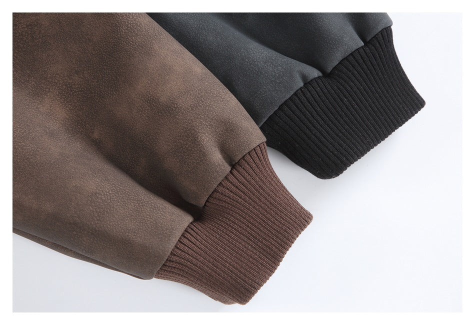 Close-up of brown and charcoal jacket sleeves with matching ribbed cuffs.