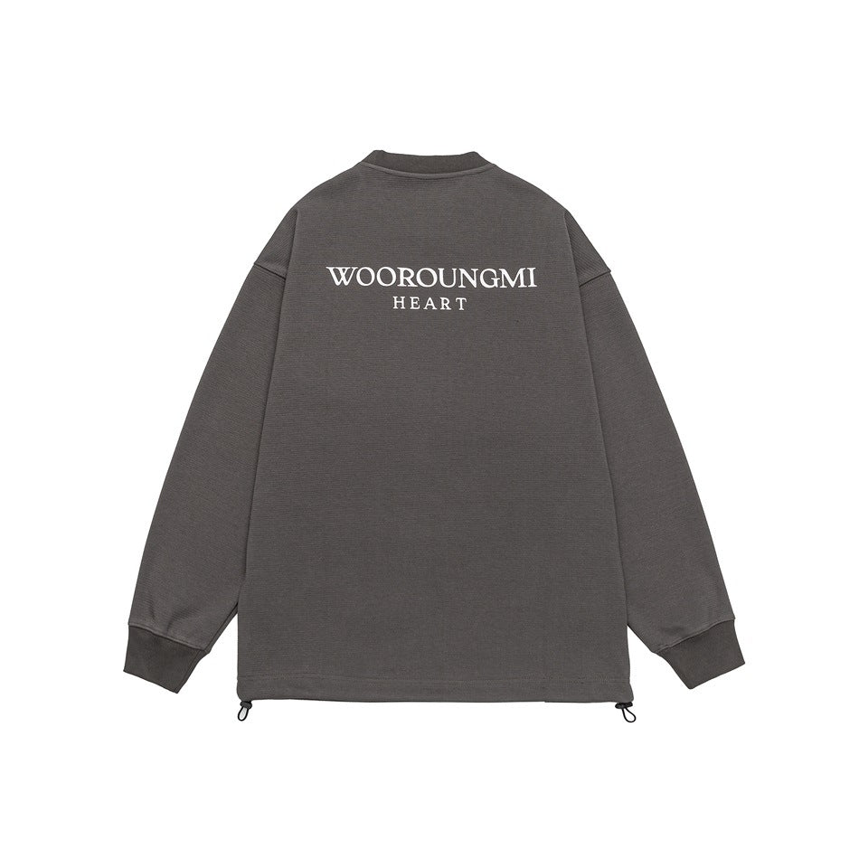 Flat back view of a charcoal-gray long-sleeve top with white “WOOROUNGMI HEART” lettering and adjustable hem cords.