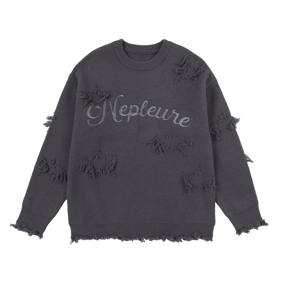 Gray distressed knit crew-neck sweater flat lay with frayed star patches and embroidered script lettering