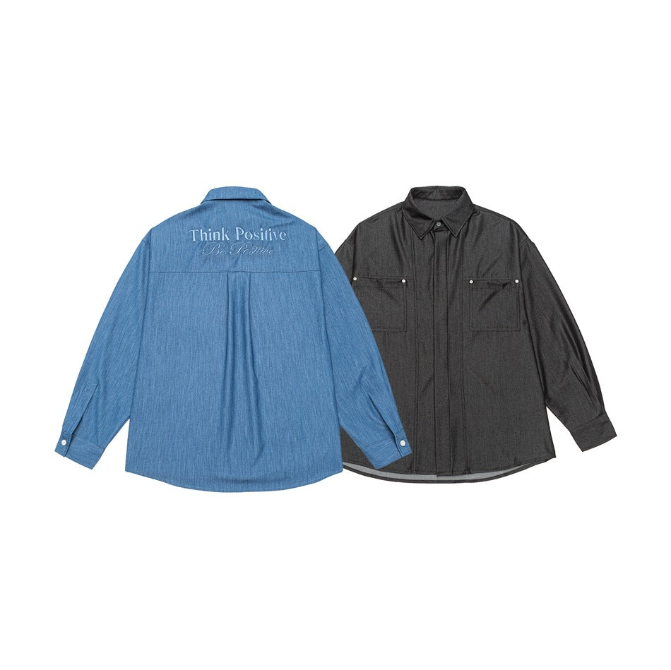 Blue shirt shown from the back beside a charcoal shirt shown from the front; the blue shirt has English text on its back.