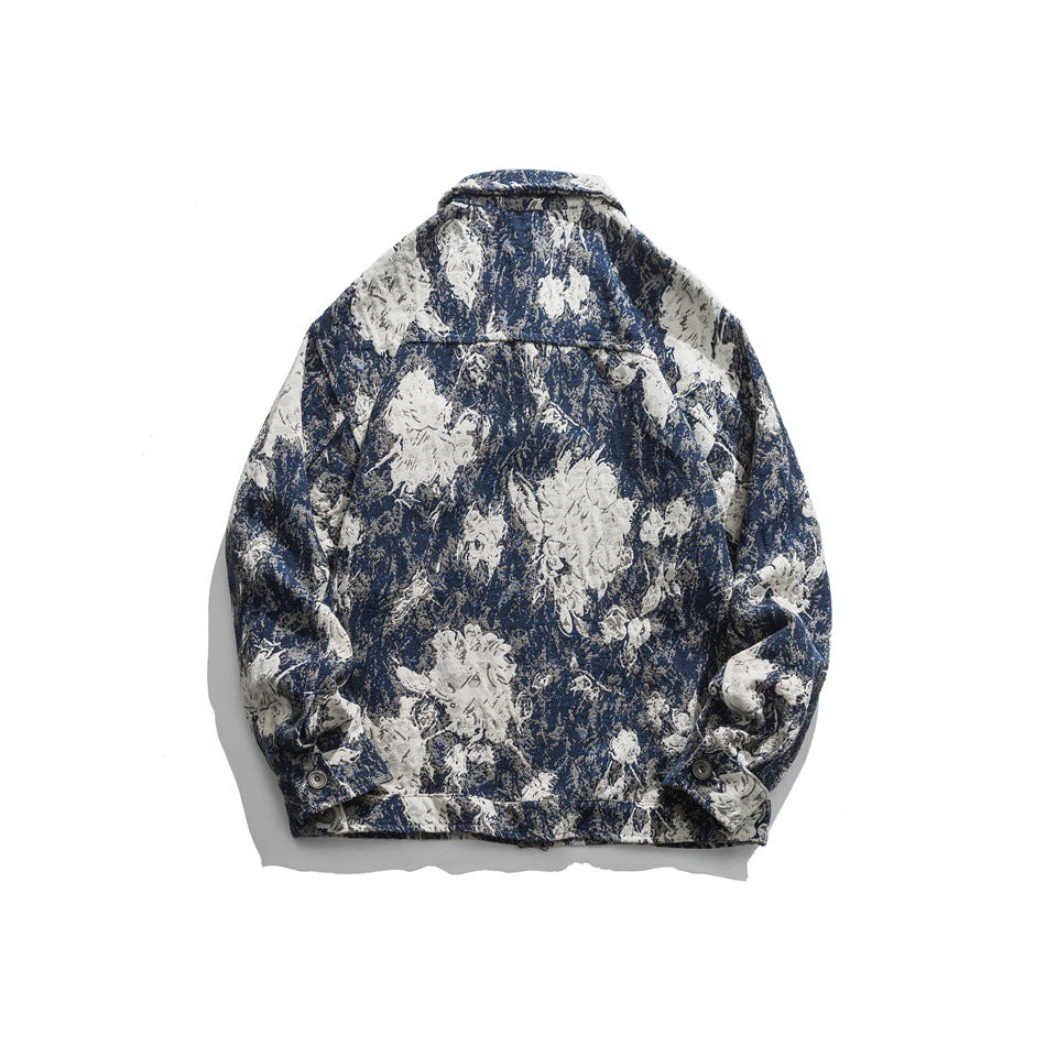 Back view of a blue and cream floral-patterned jacket laid flat on a white background.