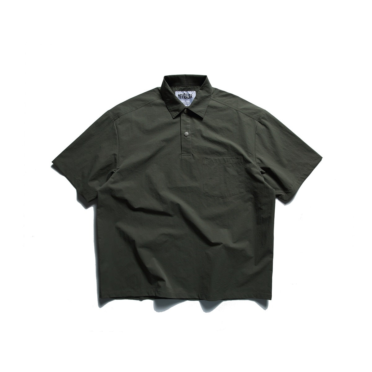 Front view of a dark olive short-sleeve collared shirt with a snap placket and chest pocket.