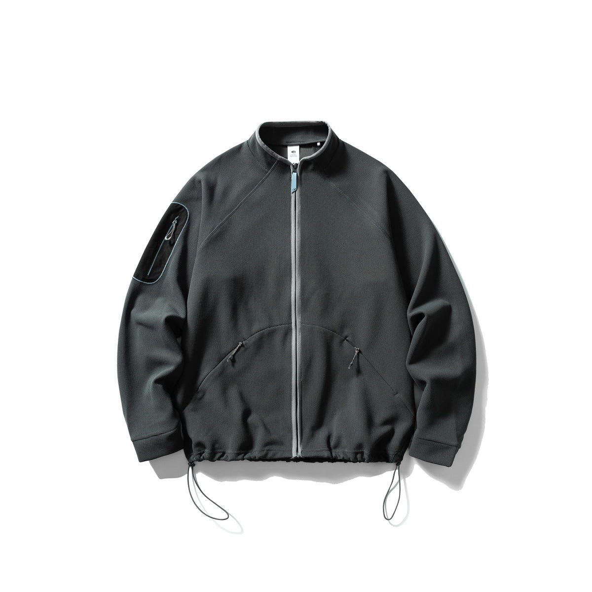 Dark gray waffle-knit stand-collar zip jacket with gray zipper, sleeve pocket and drawcord hem, flat view