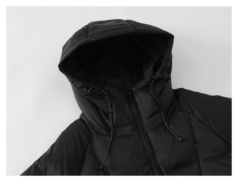 Close-up of a black puffer jacket hood showing its lining, adjustable drawcords, and front zipper.