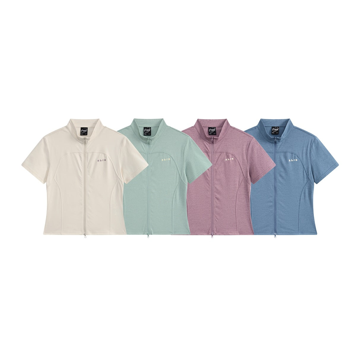 Four short-sleeve zip tops shown from the front in ivory, pale mint, mauve and blue.