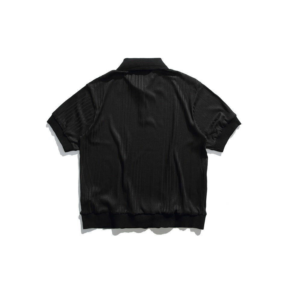 Back view of black ribbed knit short-sleeve polo shirt with ribbed collar, cuffs and hem band, flat lay