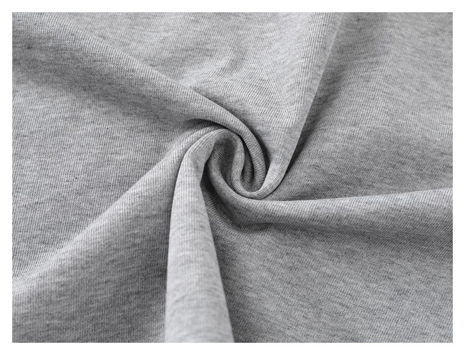 Close-up of heather-gray fabric gathered into soft folds.