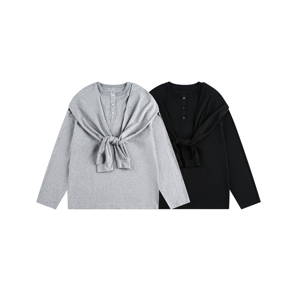 Gray and black long-sleeve henley tops displayed flat, each with a second top tied across the chest.